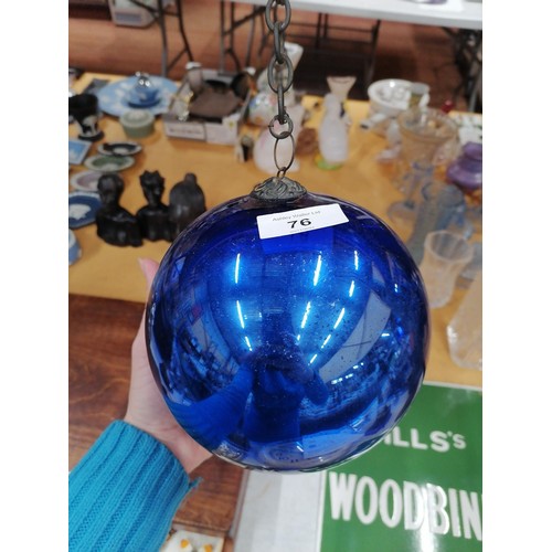 76 - A LARGE VICTORIAN MIRRORED BLUE GLASS WITCHES BALL ON A CHAIN, CIRCUMFERENCE APPROX 51CM