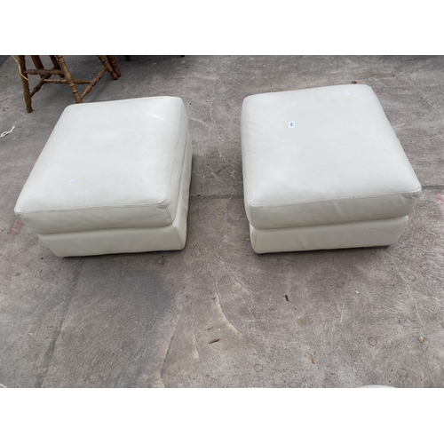 3056 - A PAIR OF CREAM LEATHER POUFFES