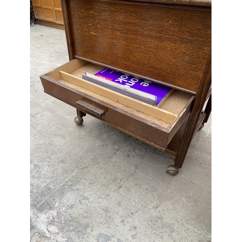 3069 - A MID 20TH CENTURY OAK SEWING BOX/TABLE ON CASTERS