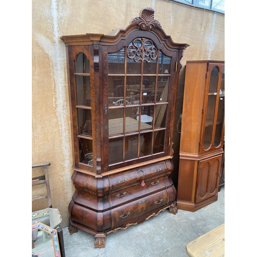 3074 - A CONTINENTAL WALNUT DISPLAY CABINET ON THREE DRAWER BOMBE BASE WITH CLAW FEET, 54