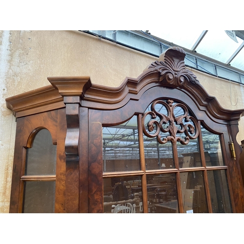 3074 - A CONTINENTAL WALNUT DISPLAY CABINET ON THREE DRAWER BOMBE BASE WITH CLAW FEET, 54