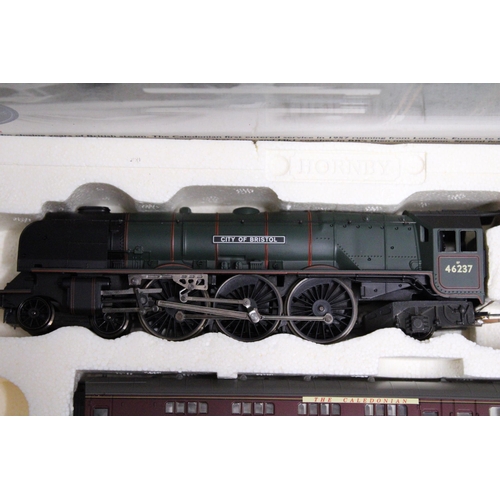 313 - A HORNBY OO GAUGE TRAIN SET - 'THE CALEDONIAN' (R2112) TO INCLUDE ADUCHESS CLASS LOCOMOTIVE AND THRE... 