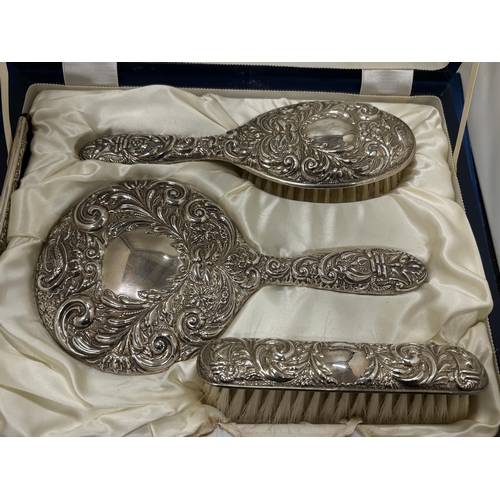 53 - A HALLMARKED BIRMINGHAM BROADWAY AND CO SILVER HAIRBRUSH, MIRROR AND BRUSH SET IN A PRESENTATION BOX