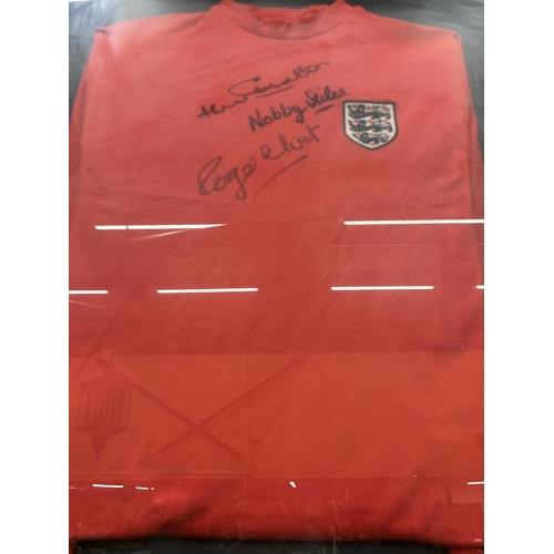 61 - A FRAMED ENGLAND 1966 REPLICA SHIRT SIGNED BY JACKIE CHARLTON, NOBBY STILES AND ROGER HUNT. VENDOR S... 