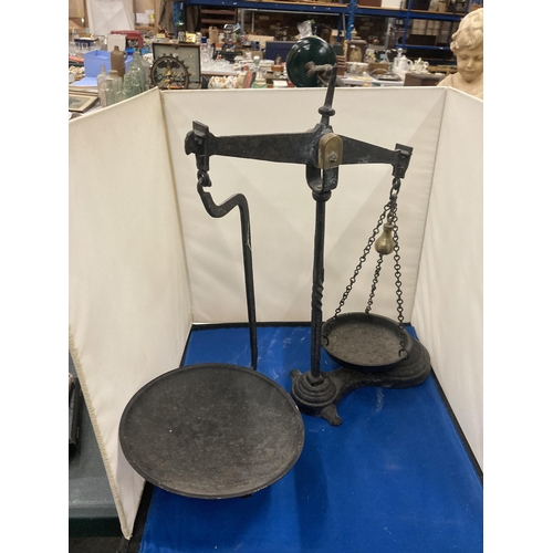 75 - A PAIR OF CAST BALANCE SCALES