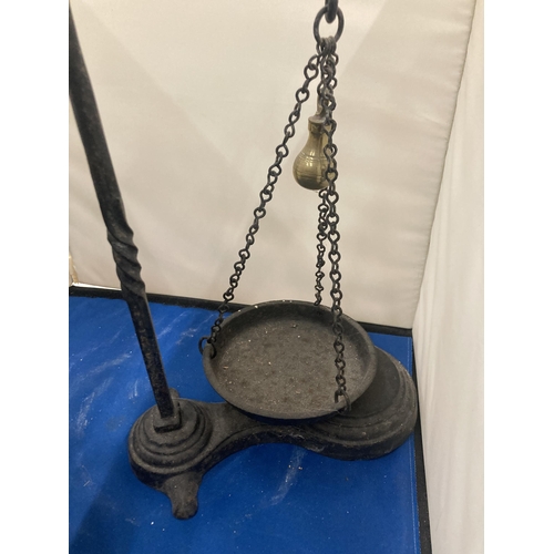 75 - A PAIR OF CAST BALANCE SCALES