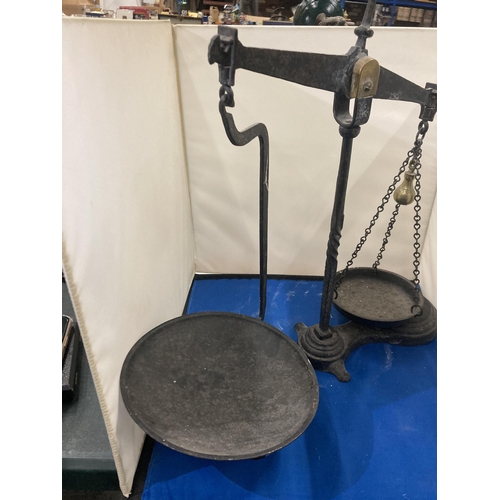 75 - A PAIR OF CAST BALANCE SCALES