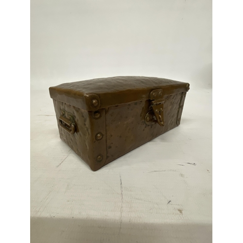 103 - AN ARTS AND CRAFTS HAMMERED COPPER AND RIVETED TRUNK STYLE BOX 16CM LONG