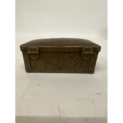 103 - AN ARTS AND CRAFTS HAMMERED COPPER AND RIVETED TRUNK STYLE BOX 16CM LONG