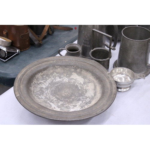 142 - A QUANTITY OF PEWTER TO INCLUDE A HAMMERED BISCUIT BARREL, TANKARDS, TEAPOTS, ETC.,