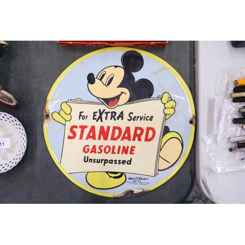 210 - AN ENAMEL SIGN 'STANDARD GASOLINE' WITH MICKEY MOUSE, DIAMETER 31CM