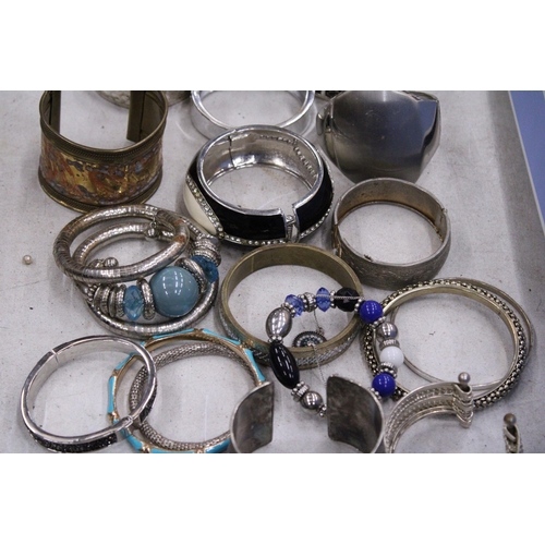 236 - A LARGE COLLECTION OF WHITE METAL BRACELETS BANGLES WITH STONES