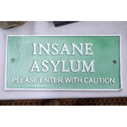 249 - A CAST 'INSANE ASYLUM' SIGN, 26CM X 15CM