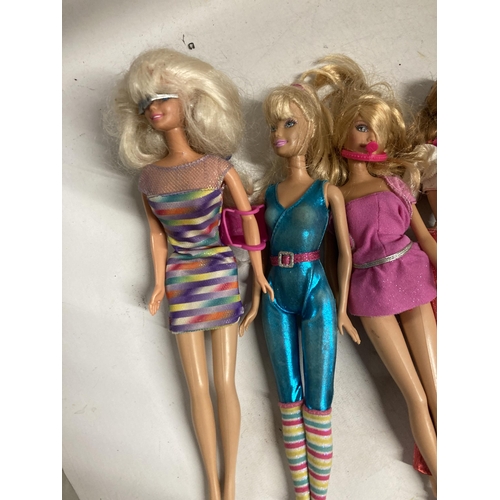 402 - EIGHT DRESSED BARBIE DOLLS