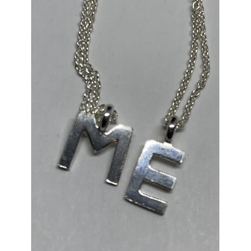 673 - FOUR MARKED SILVER NECKLACES TO INCLUDE M, E AND L INITIALS