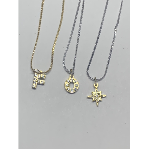 743 - FIVE WHITE AND YELLOW METAL NECKLACES WITH PENDANTS