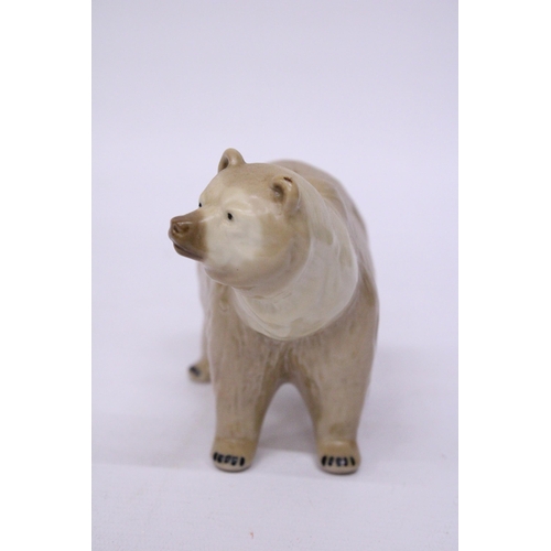 883 - A CERAMIC POLAR BEAR FIGURE