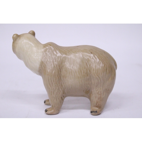 883 - A CERAMIC POLAR BEAR FIGURE