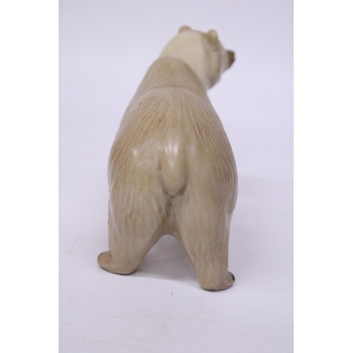 883 - A CERAMIC POLAR BEAR FIGURE