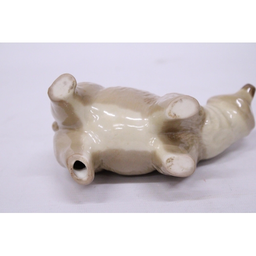 883 - A CERAMIC POLAR BEAR FIGURE