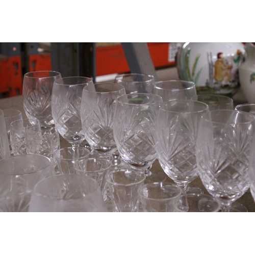 1080 - A LARGE QUANTITY OF GLASSWARE TO INCLUDE BOWLS, WINE GLASSES, SHERRY, BRANDY, ETC