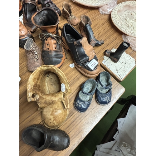 1169 - A LARGE COLLECTION OF POTTERY BOOTS AND CLOGS