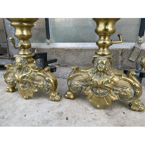 1521 - A PAIR OF LARGE DECORATIVE BRASS FIRE DOGS