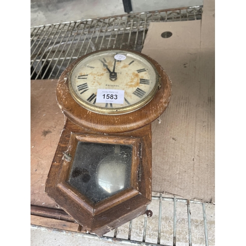 1583 - A SMALL OAK CASED PARRETT SWINDON WALL CLOCK