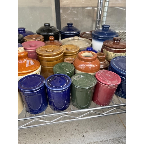 1594 - A LARGE ASSORTMENT OF CERAMIC AND STONEWARE LIDDED POTS AND VESSELS