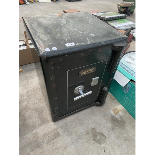 1740 - A HEAVY DUTY MILNERS SAFE COMPLETE WITH KEY