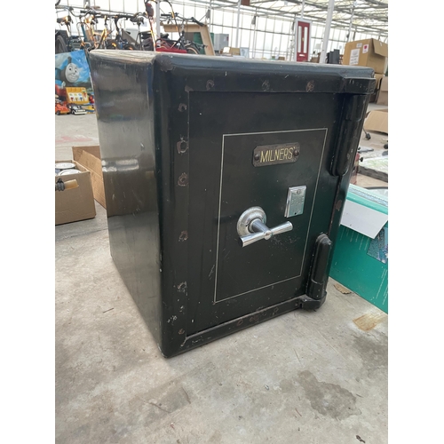 1740 - A HEAVY DUTY MILNERS SAFE COMPLETE WITH KEY