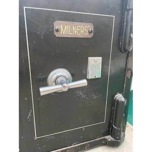 1740 - A HEAVY DUTY MILNERS SAFE COMPLETE WITH KEY