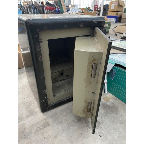 1740 - A HEAVY DUTY MILNERS SAFE COMPLETE WITH KEY