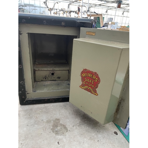 1740 - A HEAVY DUTY MILNERS SAFE COMPLETE WITH KEY