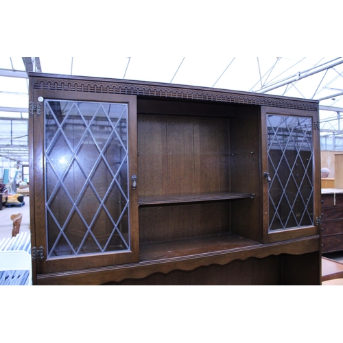 3001 - A REPRODUCTION DRESSER WITH GLAZED AND LEADED UPPER PORTION, 59