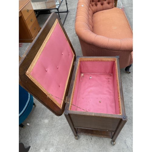 3069 - A MID 20TH CENTURY OAK SEWING BOX/TABLE ON CASTERS