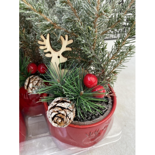 32 - EIGHT CHRISTMAS CONIFERS WITH CHRISTMAS DEER, BERRIES AND FIR CONES ACCESSORIES IN RED CERAMIC DEER ... 