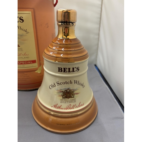 355 - A BOXED AND SEALED BELL'S EXTRA SPECIAL OLD SCOTCH WHISKY IN A WADE PORCELAIN DECANTER FINISHED IN 2... 