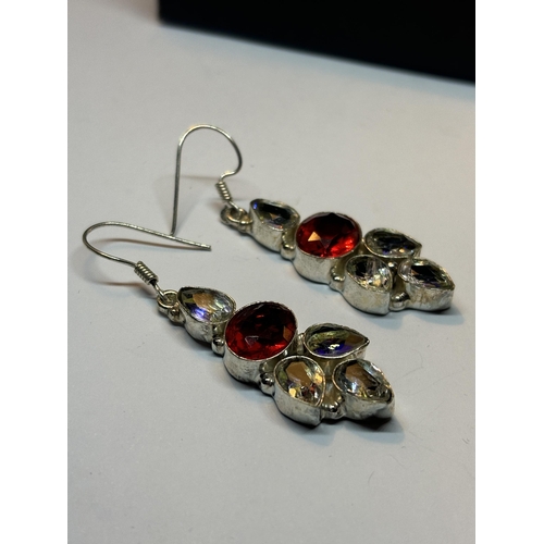 620 - A PAIR OF MARKED SILVER DROP EARRINGS WITH CLEAR AND RED STONES IN A PRESENTATION BOX