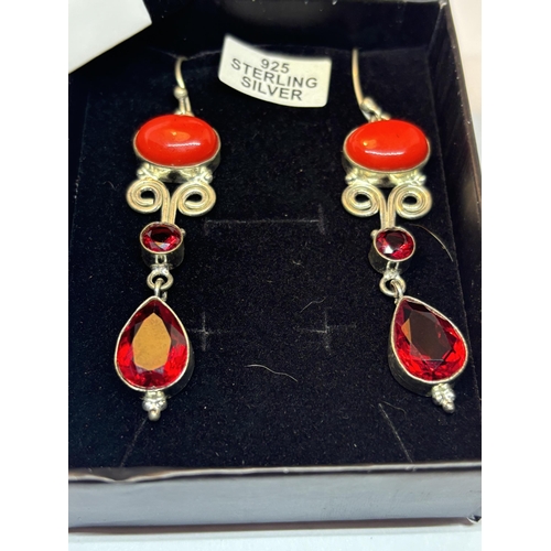 624 - A PAIR OF MARKED SILVER CORAL AND GARNET EARRINGS IN A PRESENTATION BOX