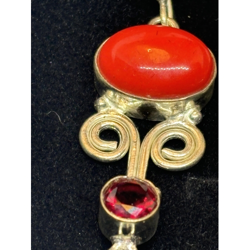 624 - A PAIR OF MARKED SILVER CORAL AND GARNET EARRINGS IN A PRESENTATION BOX