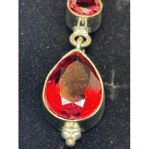 624 - A PAIR OF MARKED SILVER CORAL AND GARNET EARRINGS IN A PRESENTATION BOX