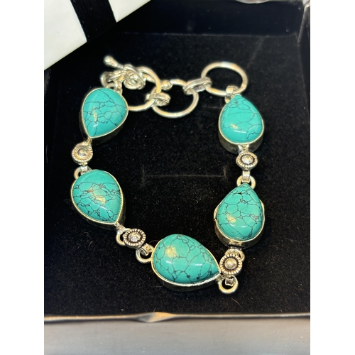 626 - A MARKED SILVER BRACELET WITH NAVAJO TURQUOISE STONES IN A PRESENTATION BOX