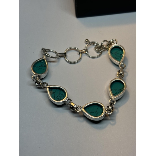 626 - A MARKED SILVER BRACELET WITH NAVAJO TURQUOISE STONES IN A PRESENTATION BOX