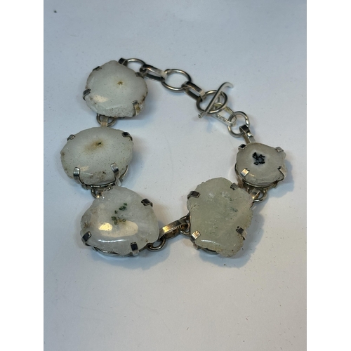 631 - A MARKED SILVER BRACELET WITH FIVE SOLAR QUARTZ STONES IN A PRESENTATION BOX