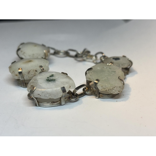 631 - A MARKED SILVER BRACELET WITH FIVE SOLAR QUARTZ STONES IN A PRESENTATION BOX