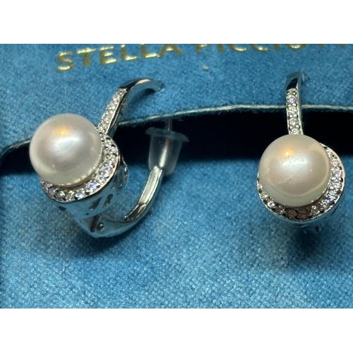 639 - A PAIR OF MARKED SILVER EARRINGS WITH PEARL AND CUBIC ZIRCONIA IN A PRESENTATION BOX