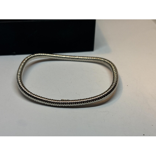 645 - A MARKED SILVER BANGLE IN A PRESENTATION BOX