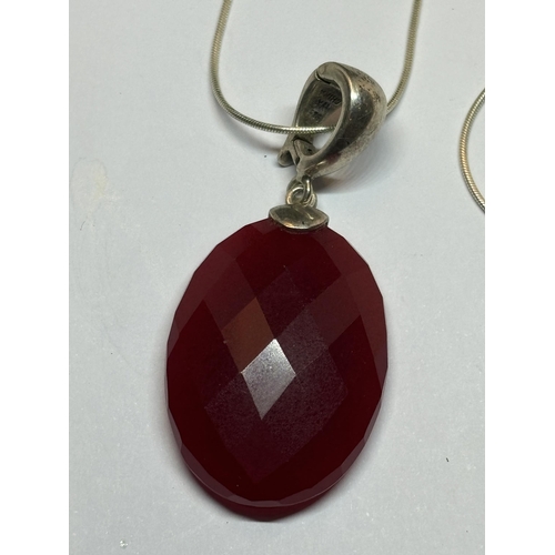 647 - A MARKED SIVER NECKLACE WITH LARGE CRANBERRY  STONE PENDANT