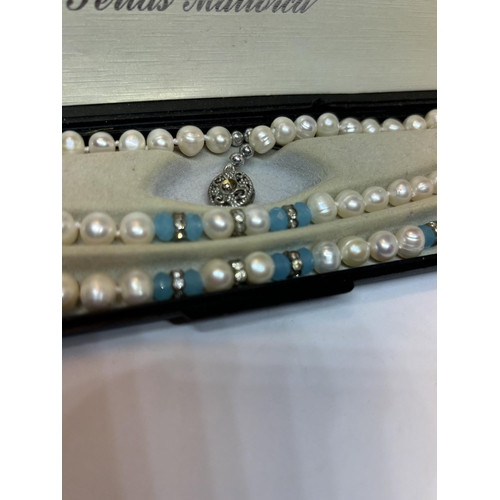 649 - A BOXED FRESHWATER PEARL SET TO INCLUDE A NECKLACE AND BRACELET